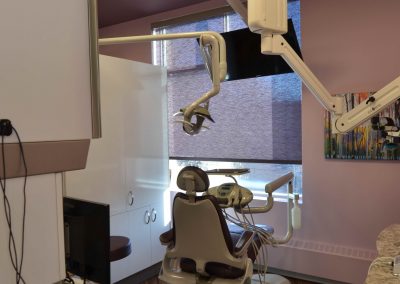 Violet walls and matching violet window covers in dental operatory