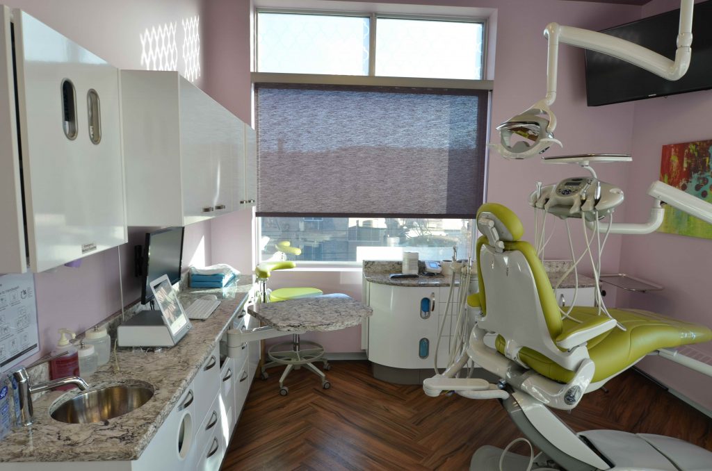 Violet walls and green dental operatory patient chair