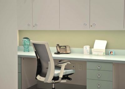 Custom built in mint and white desks at dental clinic