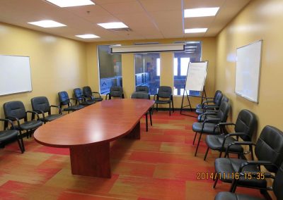 Conference room with large boardroom table and seating