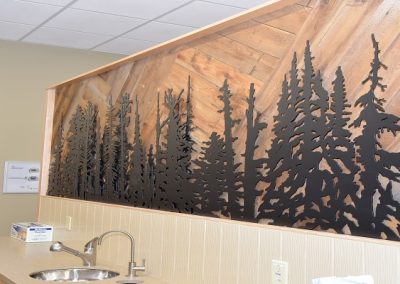 Custom wooden wall design with forest of trees