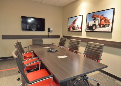 Commercial boardroom with custom red office chairs