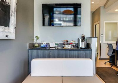 Coffee bar and seating area in dental office