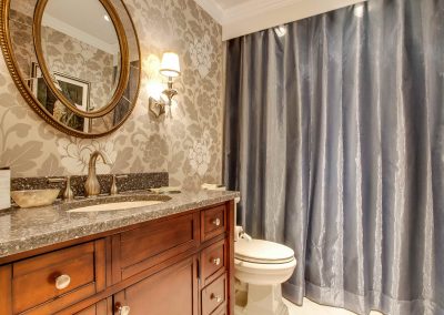 Exquisite golden floral wallpaper feature in bathroom renovation