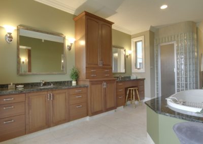 Large master bathroom with custom wooden cabinets