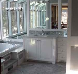 Bathroom renovation with mirrored walls and natural light