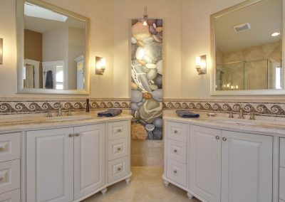Bathroom remodel with beach theme and his and her matching vanities