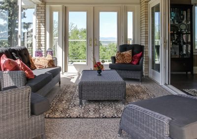 Sunroom with patio furniture for seating