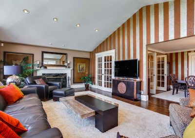 Striped wallpaper feature wall in family tv room