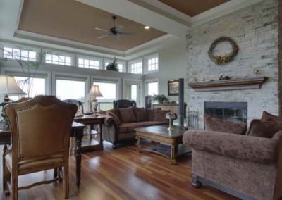 Traditionally styled great room with large stone fireplace