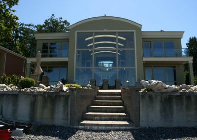 Steps leading up from beach to large oceanfront property