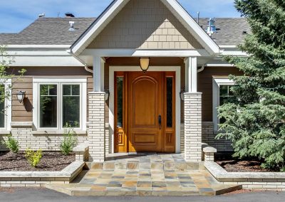 Front entrance of home with large wooden door