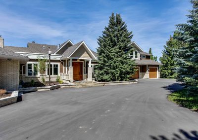 Large driveway leading towards front entrance of home