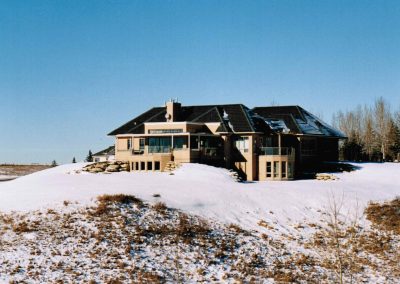 Newly renovated house on acreage covered in snow
