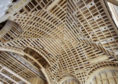 Arched wooden framed ceiling details being built