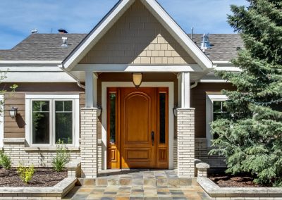 Wooden front door leading into home