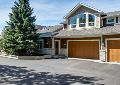 Driveway leading up to double car garage