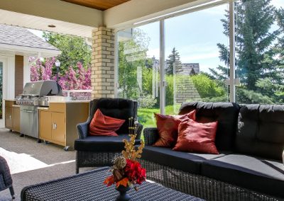 Outdoor patio with glass windows surrounding the patio