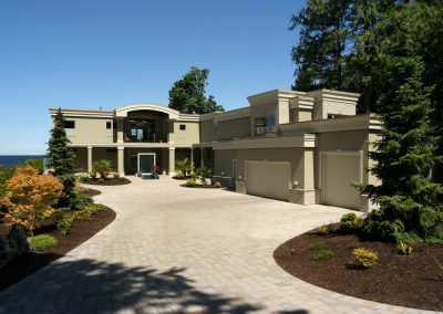 Large driveway leading up to oceanfront home