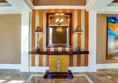 Entryway of home with large table and mirror