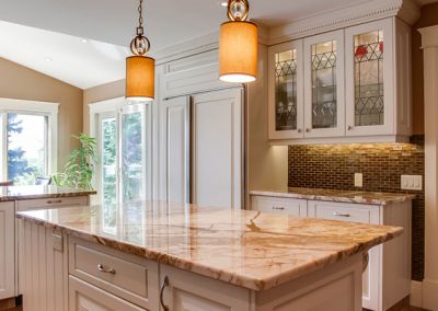 kitchen renovation with white cabinets and quart counter tops