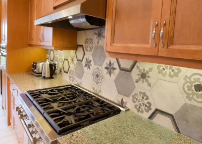 Hexagon kitchen backsplash with intricate designs