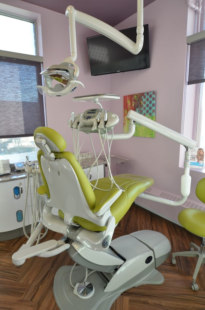 Violet walls and matching violet window covers in dental operatory