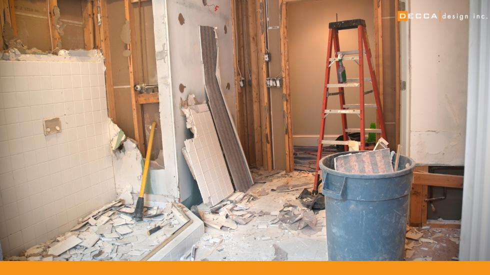 Contractors preparing a renovation site on demo day for a Decca Design project in Alberta